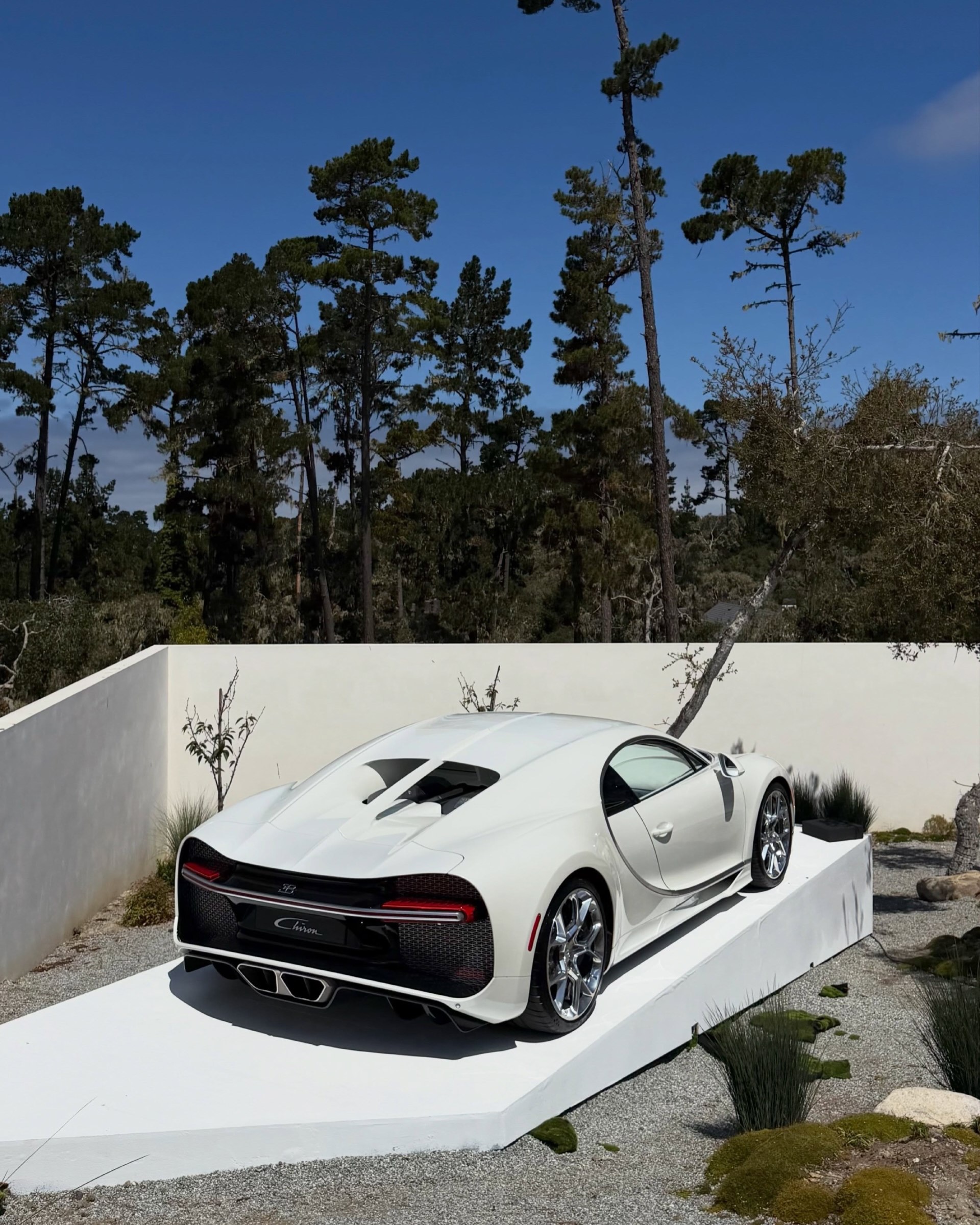 Custom Bugatti vehicle display stand at the event venue, view 1